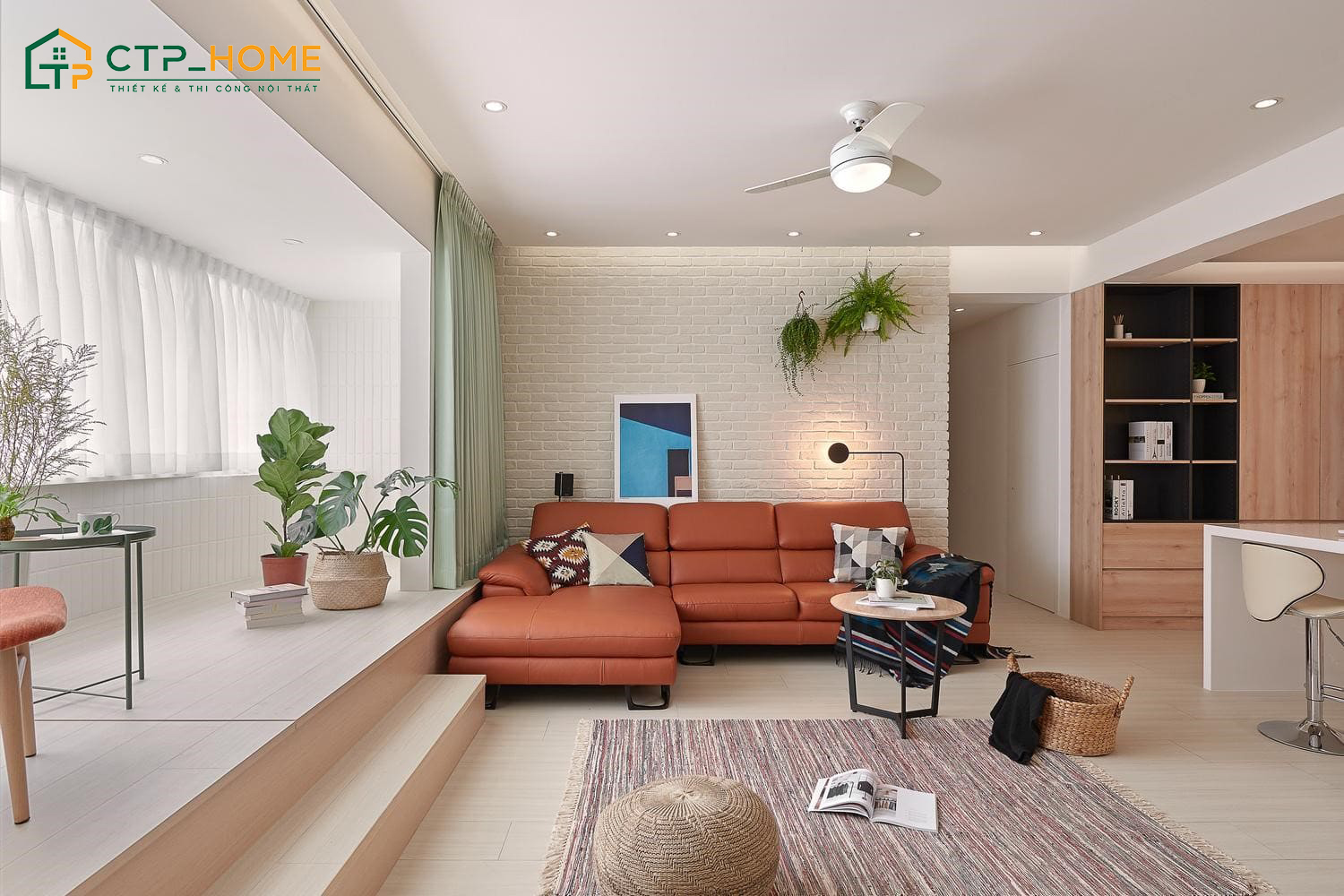Mẫu thiết kế phòng khách chung cư tối giản với sofa sofa chữ L đặt sát tường giúp tối ưu diện tích sinh hoạt