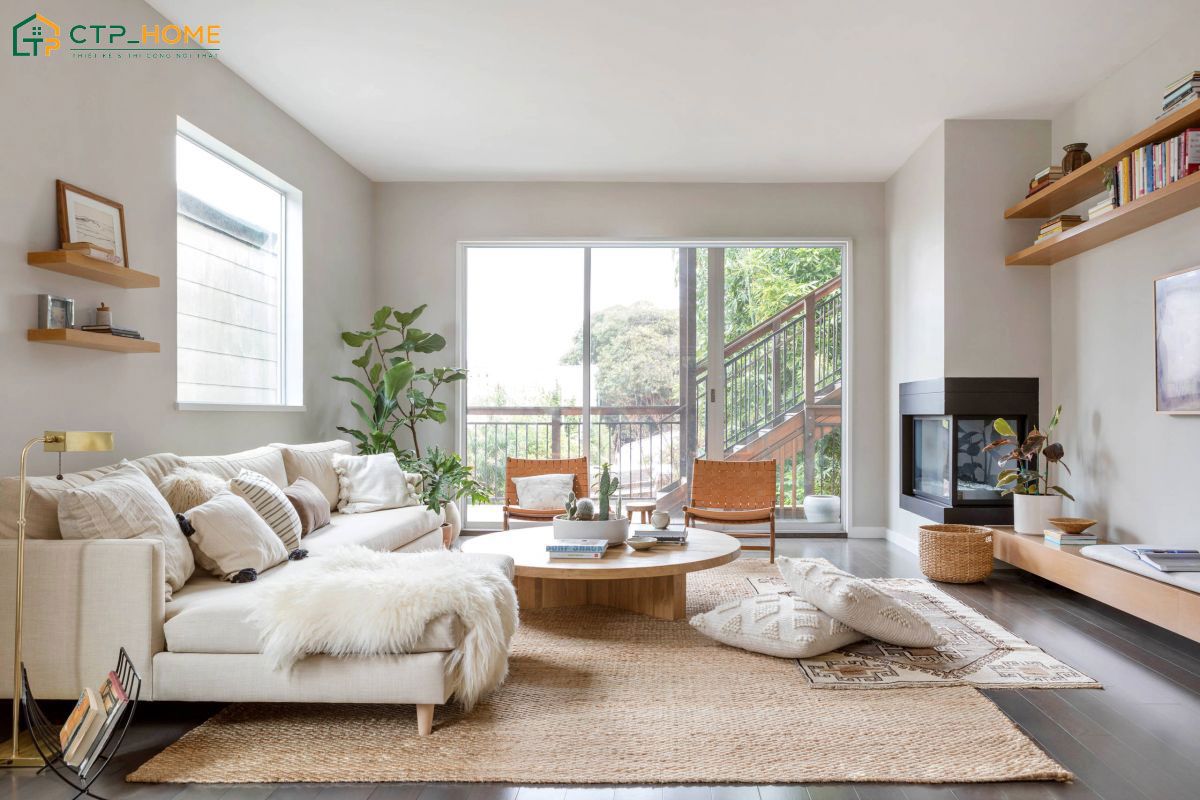 Mẫu phòng khách phong cách Bắc Âu với tông màu trắng chủ đạo, kết hợp bộ sofa vải nỉ