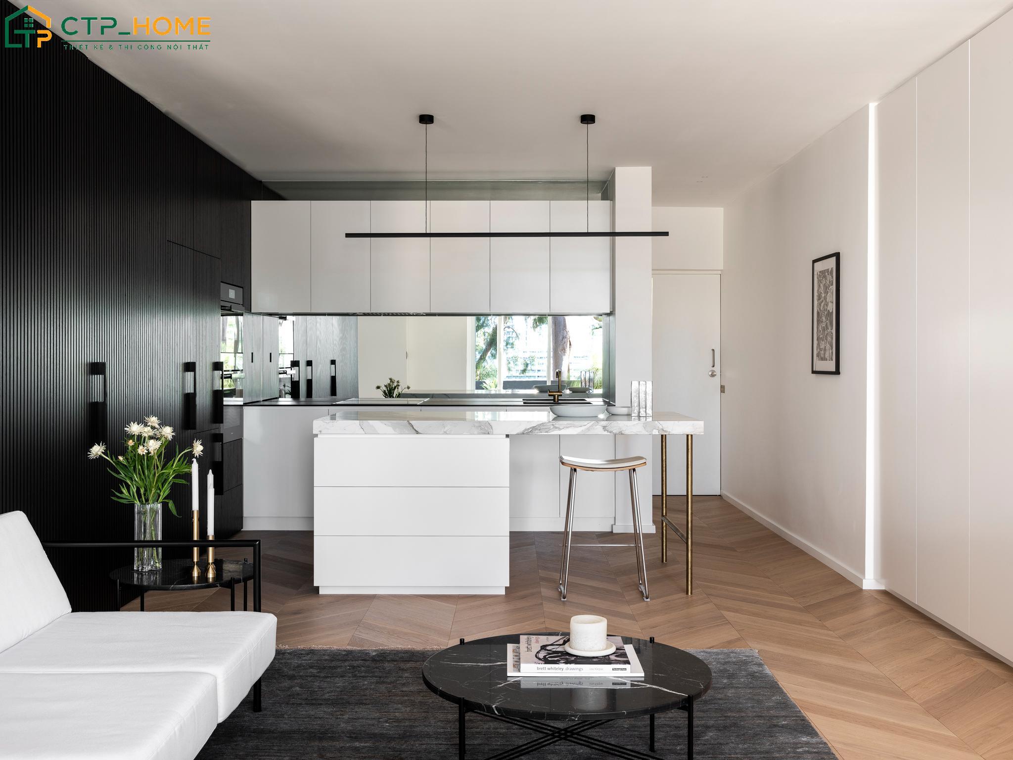 Sử dụng đảo bếp cùng quầy bar mini giúp phân chia không gian và tăng diện tích lưu trữ