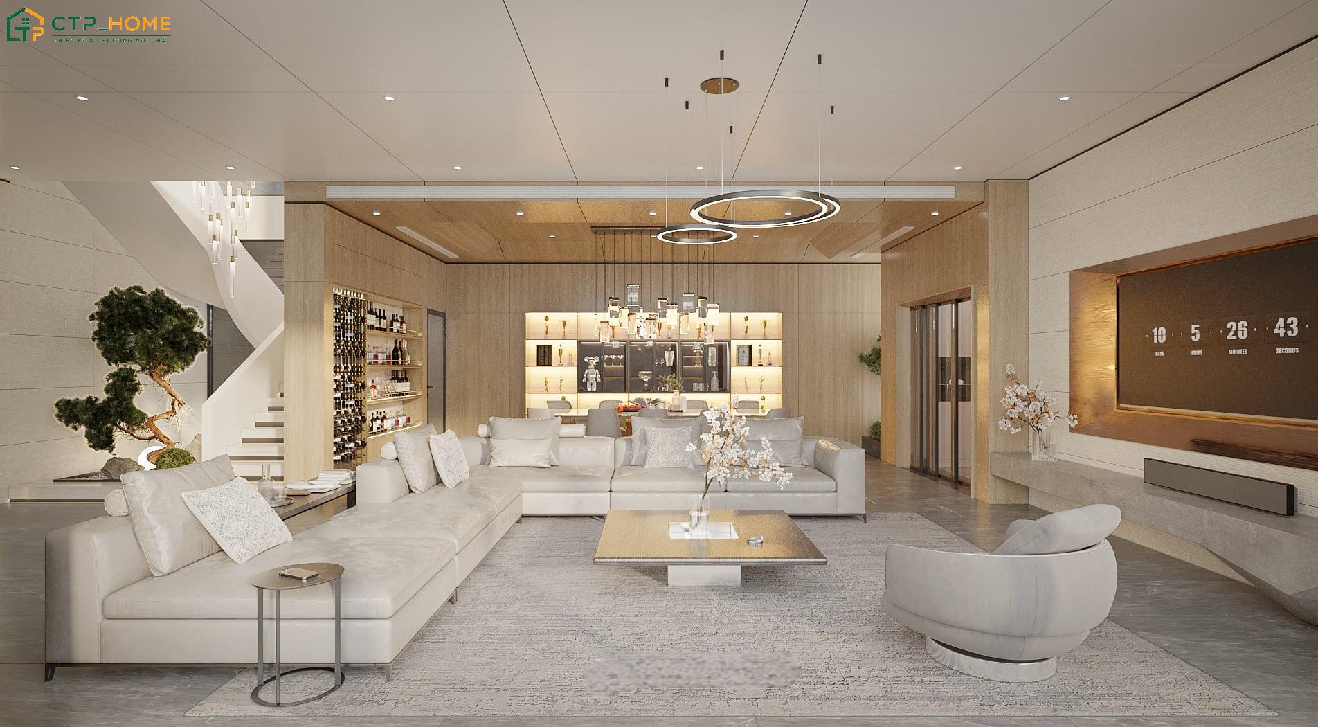 Việc kết hợp sofa với ghế đơn theo bố cục đối xứng giúp không gian trở nên hài hòa hơn