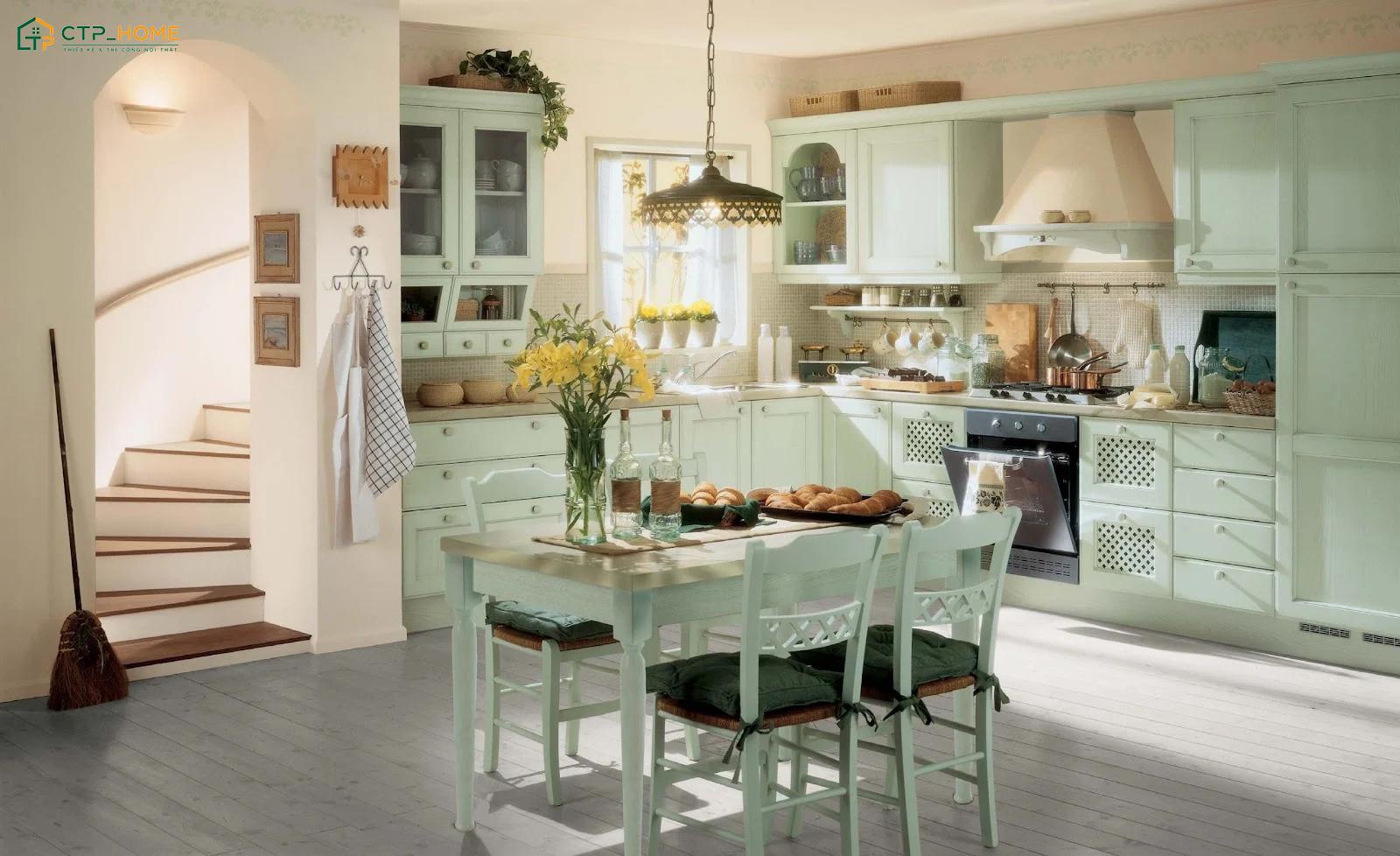 Mẫu decor nhà bếp phong cách Vintage sẽ sử dụng nhiều chất liệu gần gũi như gỗ tự nhiên, gạch bông, gốm sứ