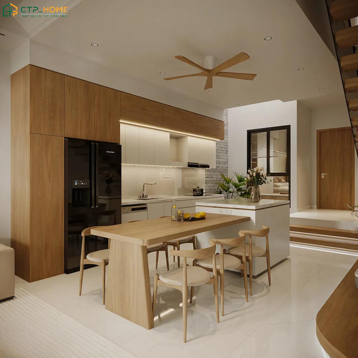 Giếng trời được bố trí giữa phòng khách và bếp giúp tăng khả năng lấy sáng và lưu thông không khí