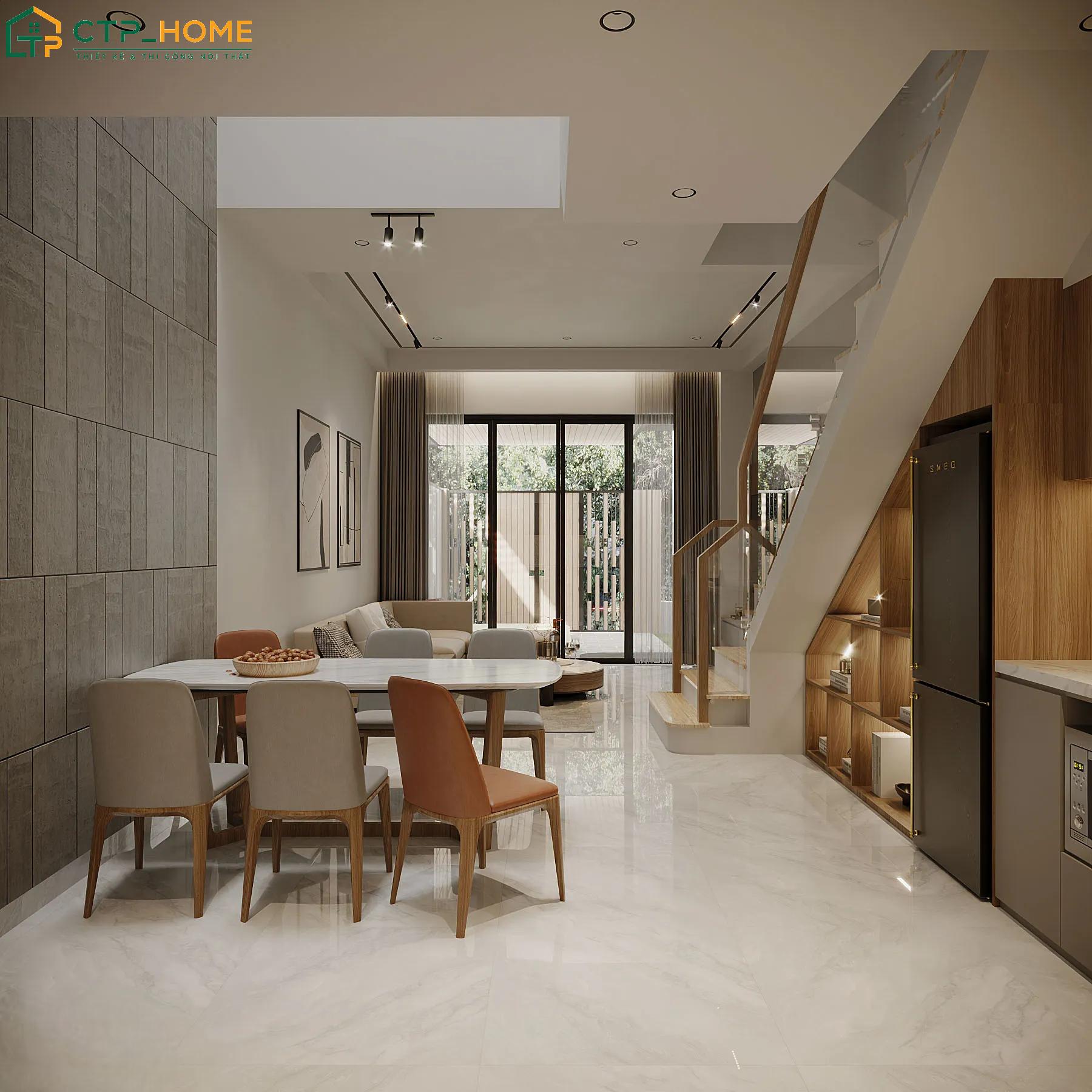 Gầm cầu thang được tận dụng để làm tủ lưu trữ giúp phòng khách kết hợp phòng ăn luôn gọn gàng