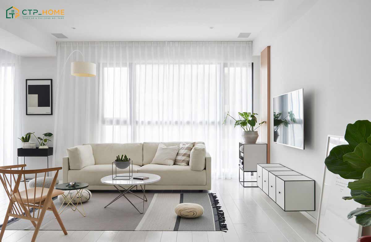 Mẫu thiết kế phòng khách phong cách Bắc Âu màu trắng sẽ được kết hợp thêm cây xanh để giúp cân bằng thị giác