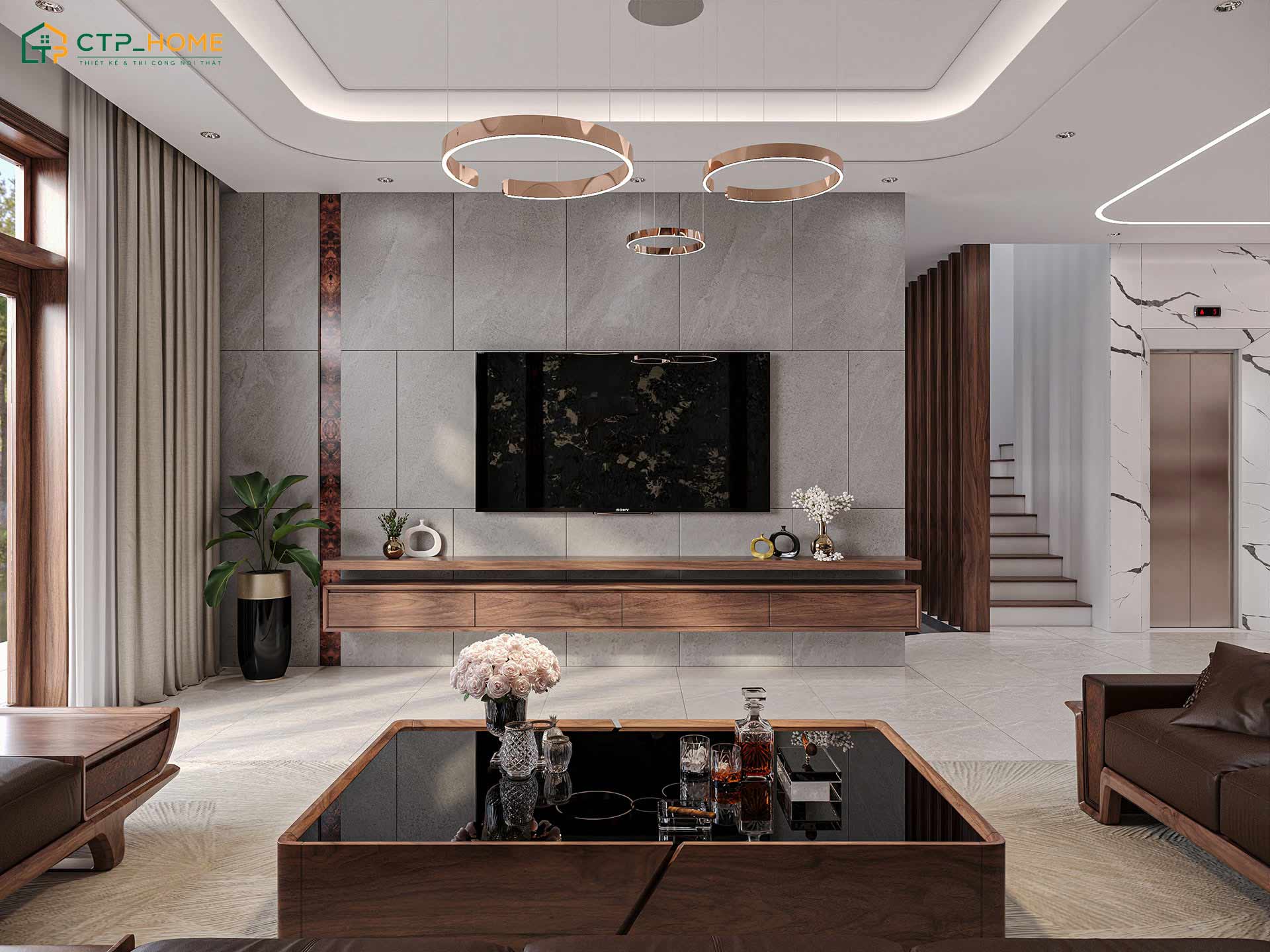 Không gian phòng khách sử dụng tone màu ghi làm chủ đạo sẽ giúp tôn lên vẻ đẹp của gỗ óc chó