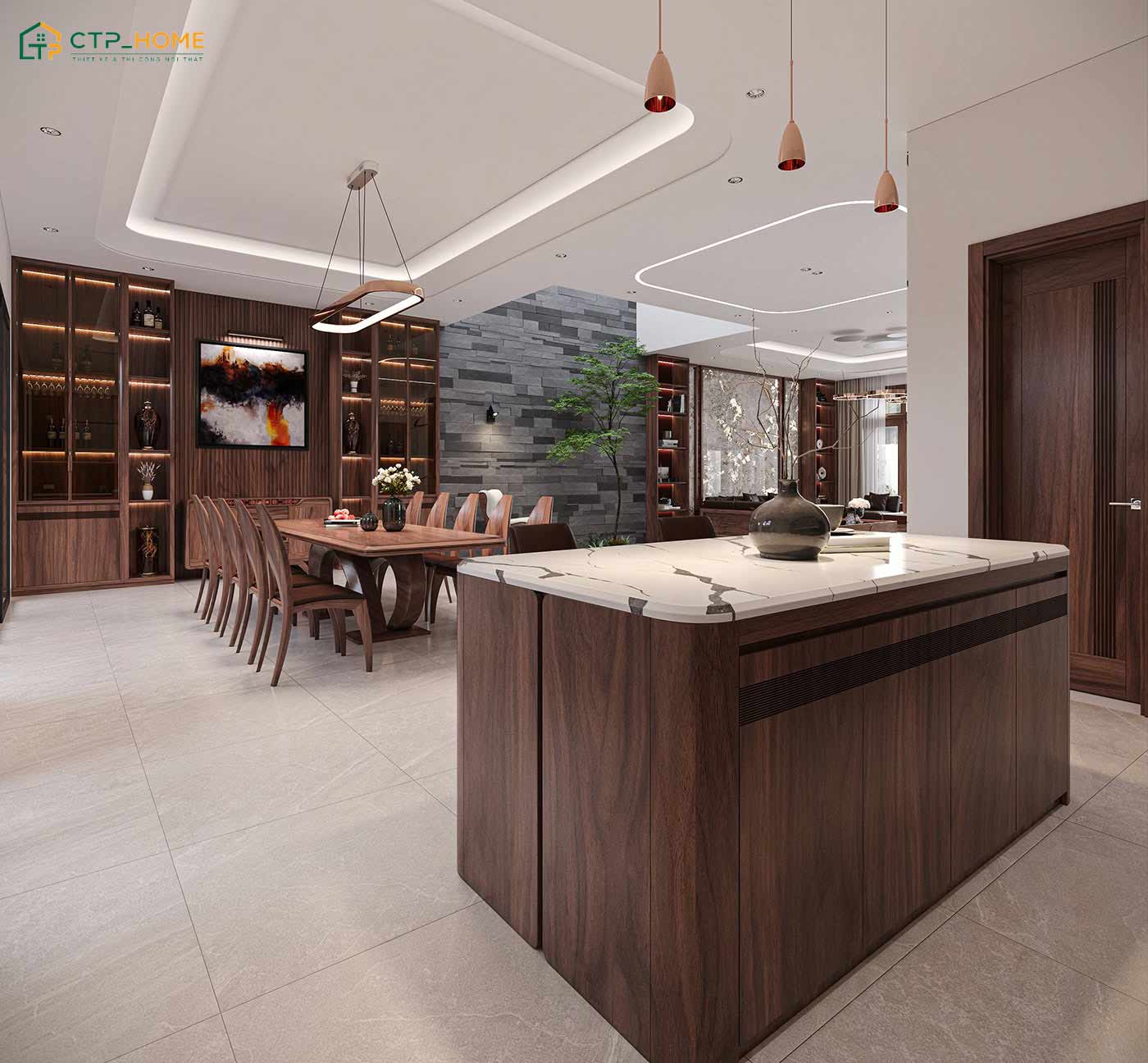 Sử dụng đảo bếp gỗ óc chó giúp gia tăng diện tích nấu nướng và tạo điểm nhấn cho toàn bộ không gian