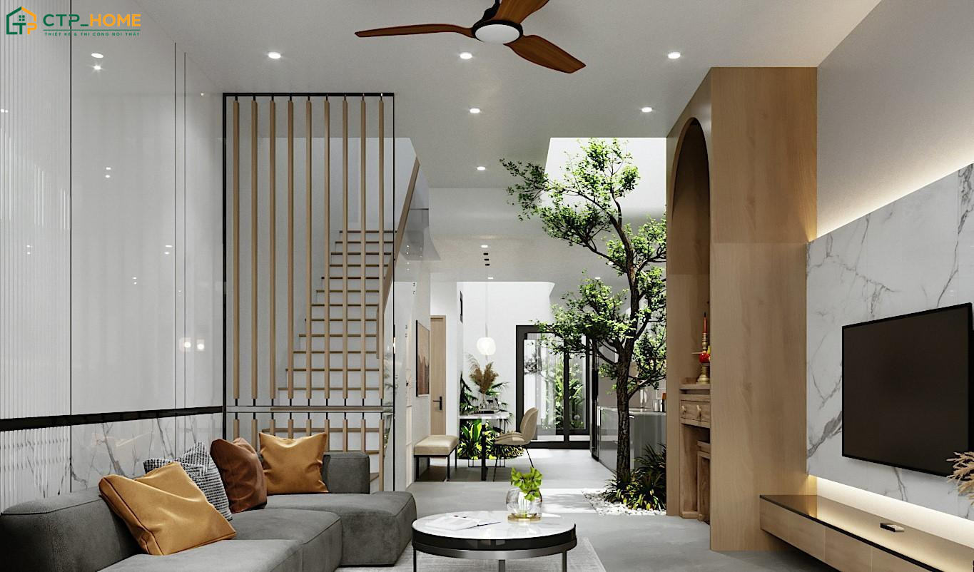Thiết kế phòng khách nhà ống 4m kết hợp cầu thang và cây xanh giúp tạo nên một không gian tươi mới và gần gũi