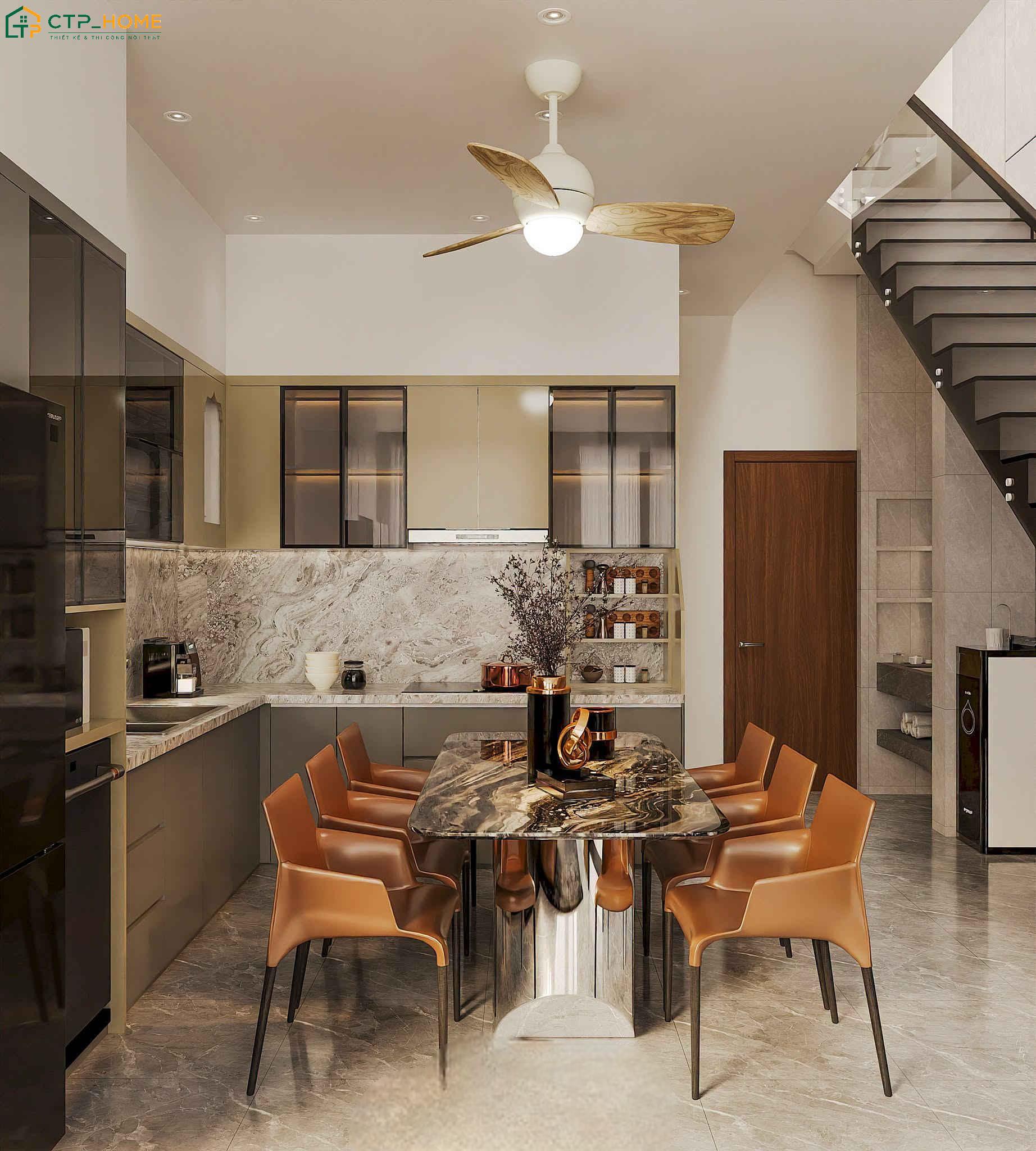 Hệ tủ bếp thiết kế liền mạch cùng cách phối màu tinh tế giúp tạo nên một không gian hiện đại và trẻ trung
