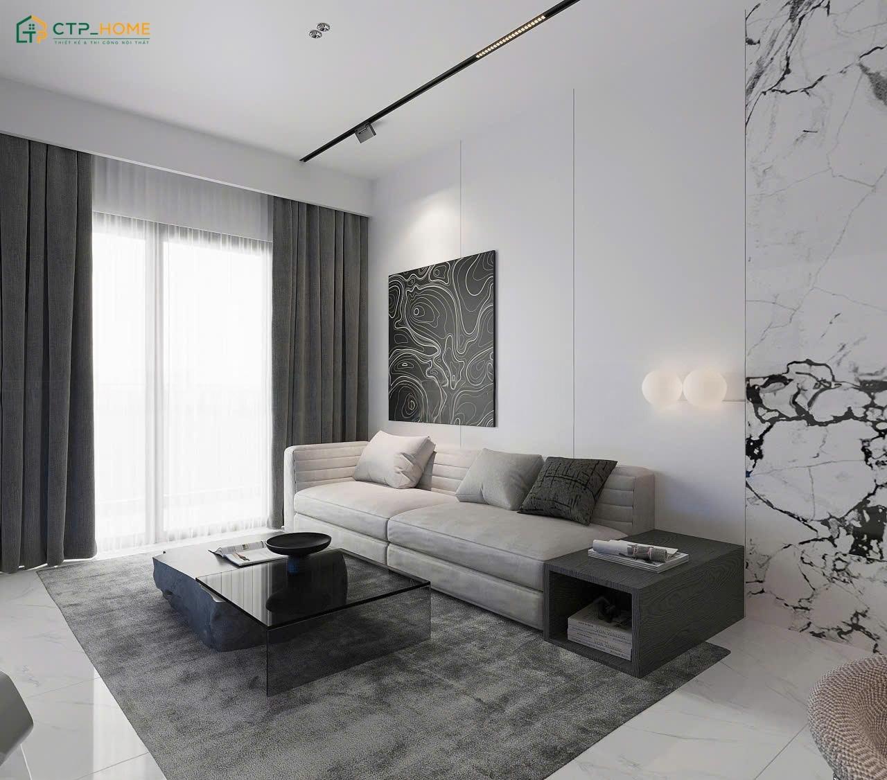 Mẫu thiết kế phòng khách màu xám trắng nổi bật với sofa màu xám đậm kết hợp cùng thảm họa tiết hình học