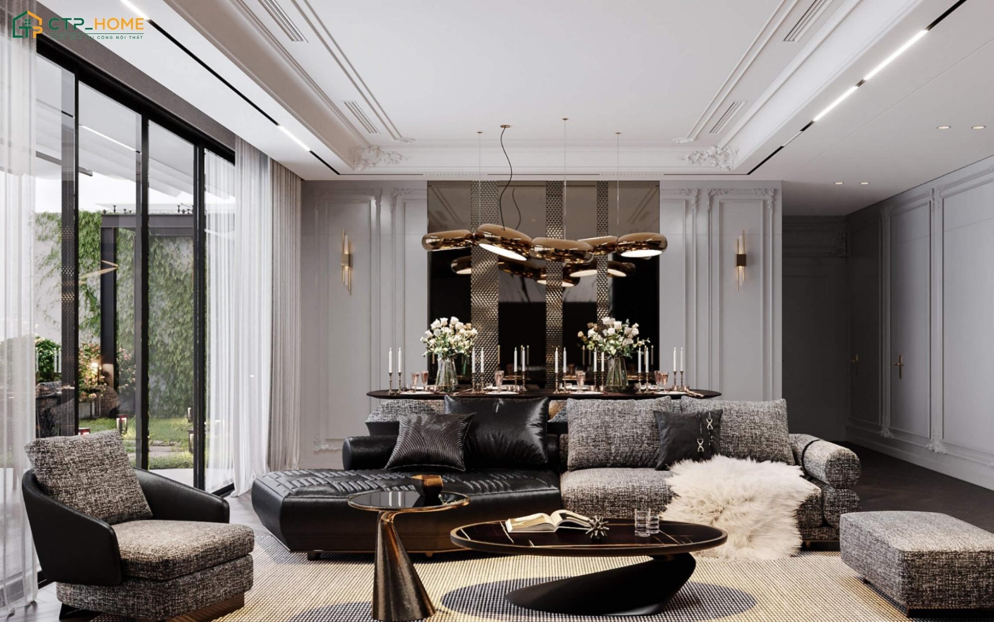 Mẫu phòng khách màu ghi xám nổi bật với sofa bọc nỉ đen xám, bàn trà mặt đá và đèn chùm ánh vàng độc đáo